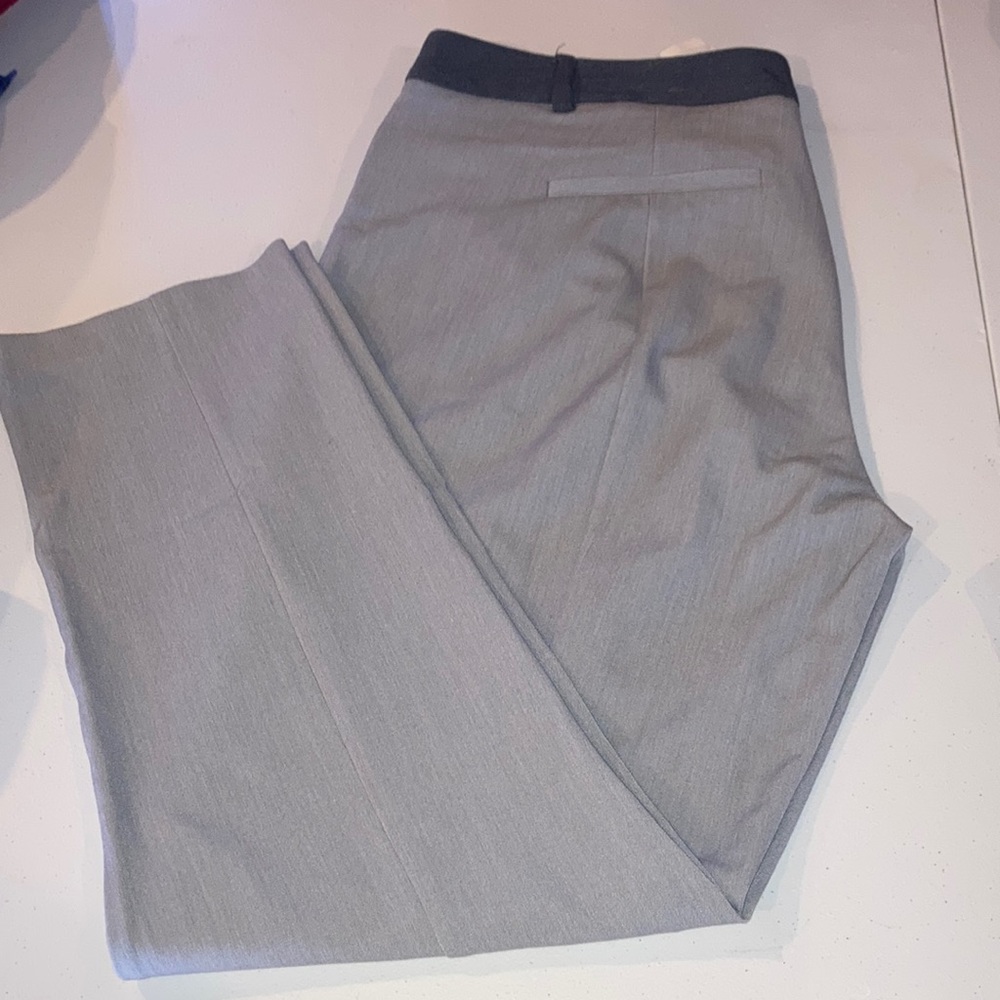 Grey straight leg trousers with dark grey waist band and slim pockets